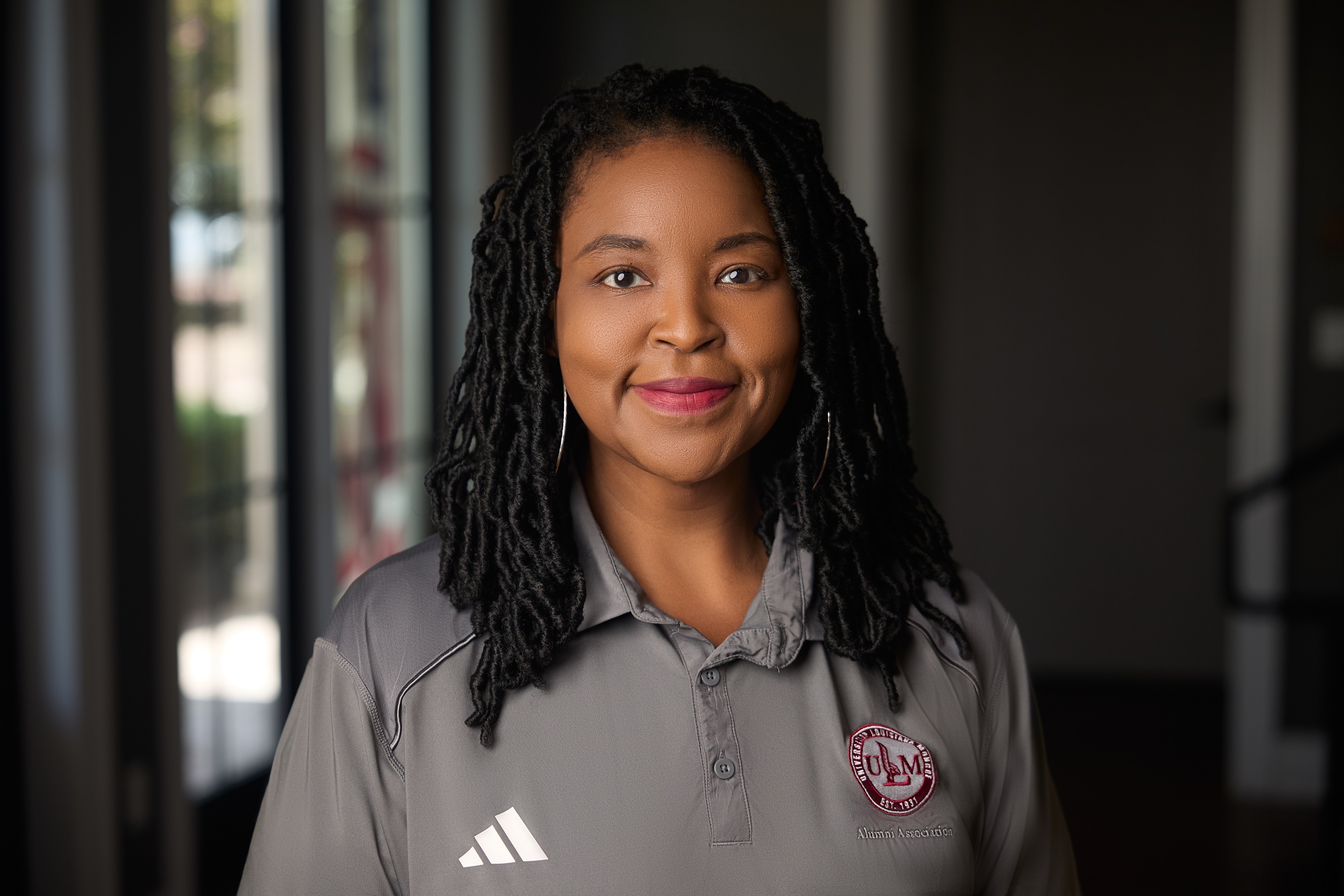 Portrait of lacy Durham, ULM Alumni Association Board Secretary, standing in the Laird Weems Office