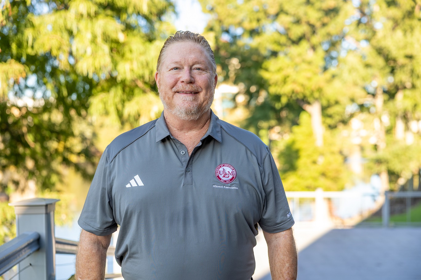 Portrait of Shawn McCoy ULM Alumni Association Board Vice President Operations, standing on campus near the bayou.