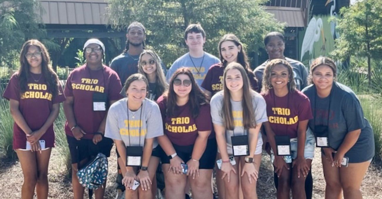2022 ULM WINGS Camp Students A group of students pose for a picture. They are wearing matching t-shirts that read "TRIO SCHOLAR".